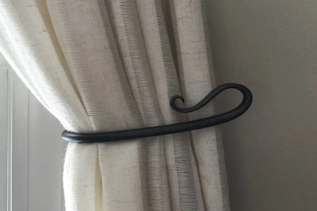 Hooks with a tie-back